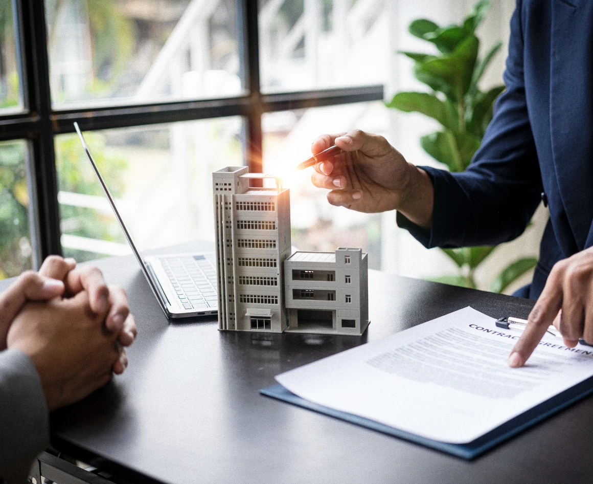 Business meeting discussing real estate contract